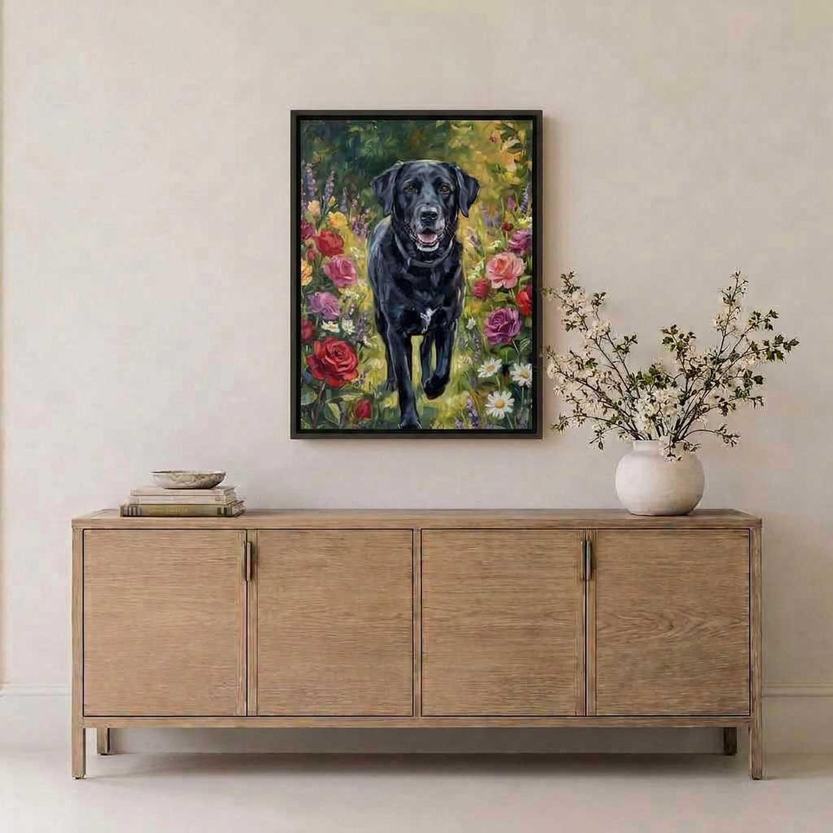 Meadow Bloom black Labrador portrait hanging above a light oak sideboard